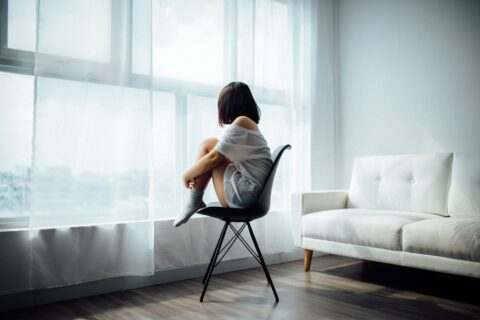 woman alone on a chair