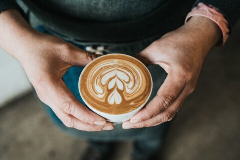 man holding a cup of coffee